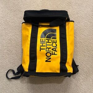 The North Face Yellow and Black Roll-Top Backpack